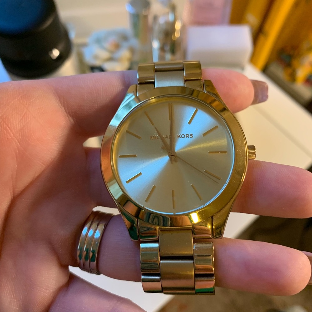 Michael Kors gold watch runway